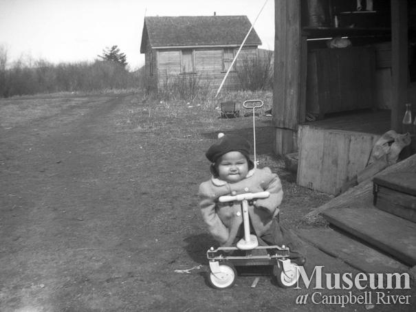 An unidentified toddler trying out new wheels