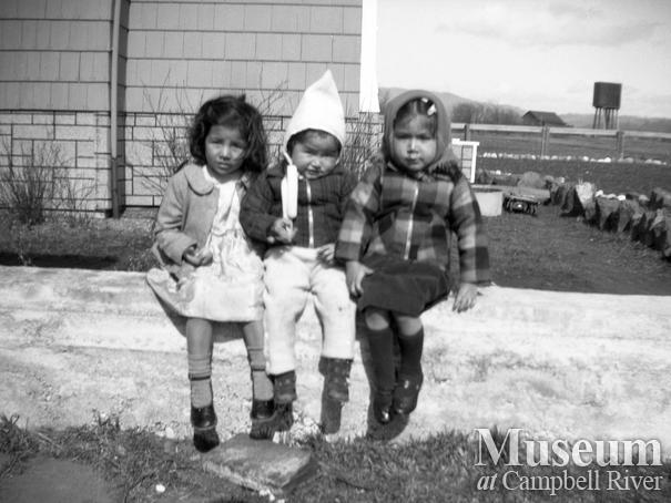 Three young children - Maggie Henderson on left
