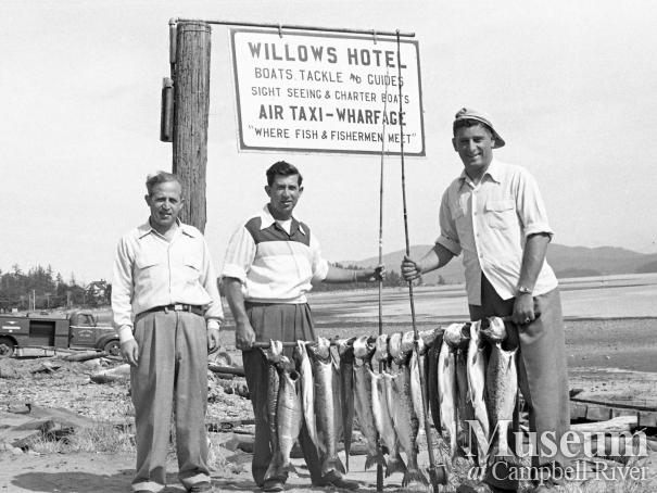 Anglers with their catch on beachfront, Campbell River