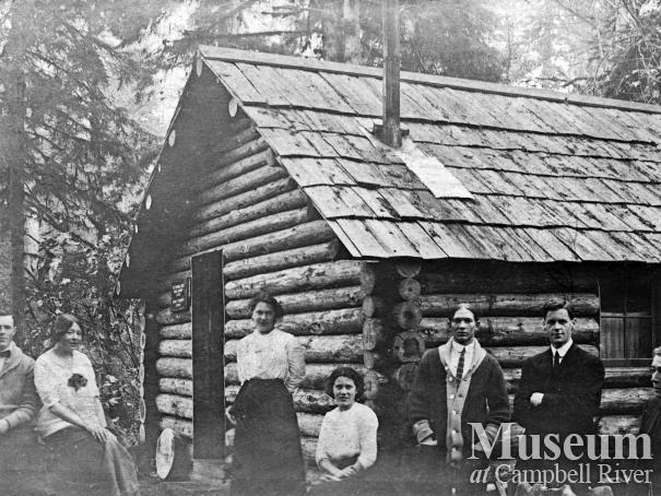 Group at cabin on the banks of the Campbell River