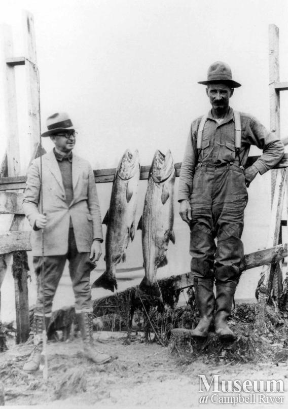 Ed Forrest, guide, with unknown angler and two fish