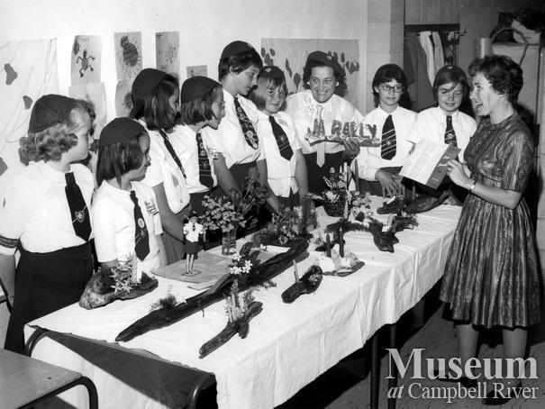Group of Campbell River Girl Guides with display of crafts