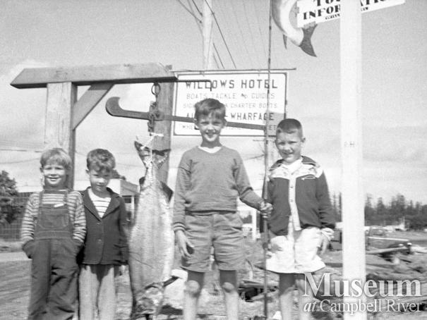 Unidentified children with a salmon at the Willows Hotel