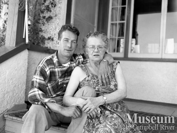 Mrs. Forbes on the front steps of the Lodge