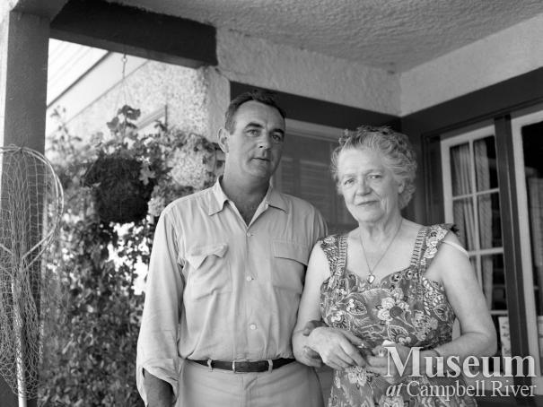 Mrs. Forbes on the front steps of the Lodge