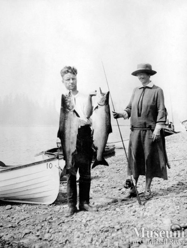 Joe Painter (?) with Mrs. Wiborn and salmon