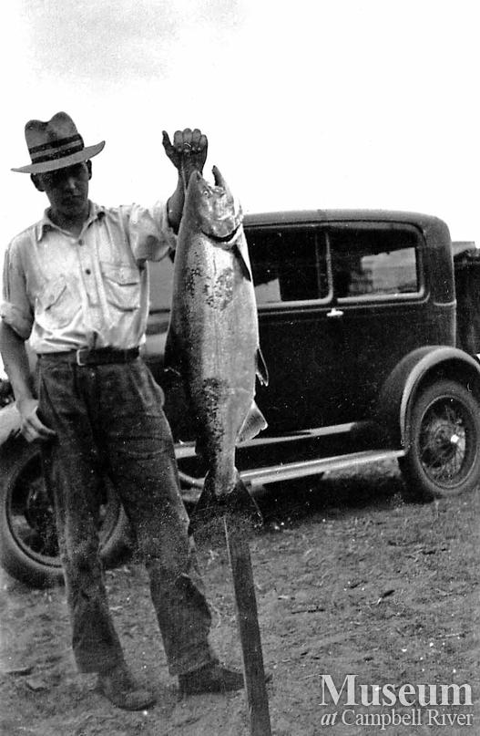 Herbert Pidcock(?) with catch of salmon
