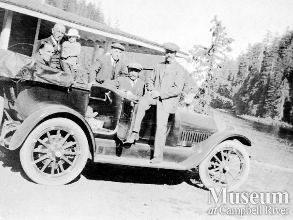 Car with passengers beside Forbes Landing Lodge