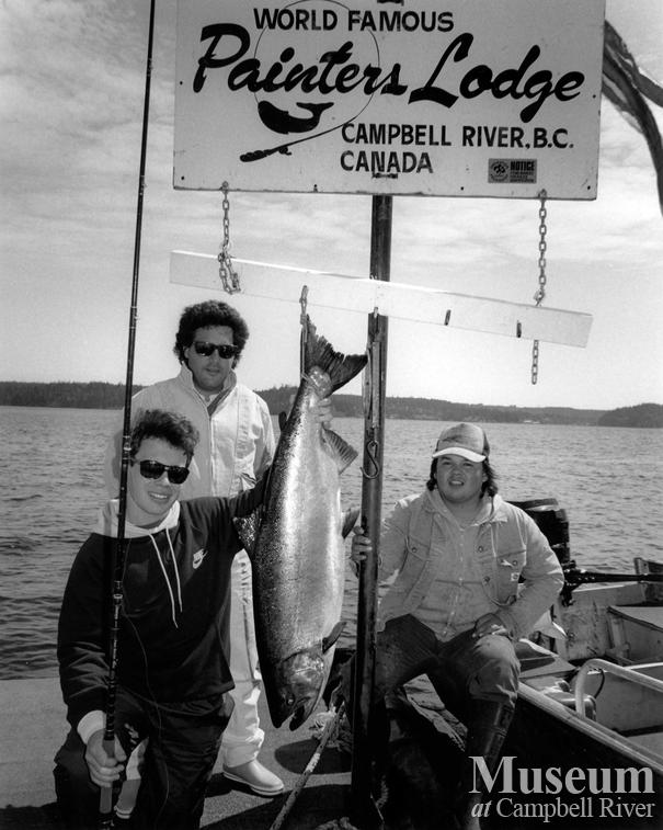 Three unknown anglers with fish
