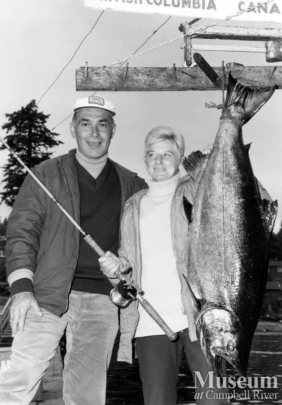 Mrs. Irvin Janko with her catch, and a man