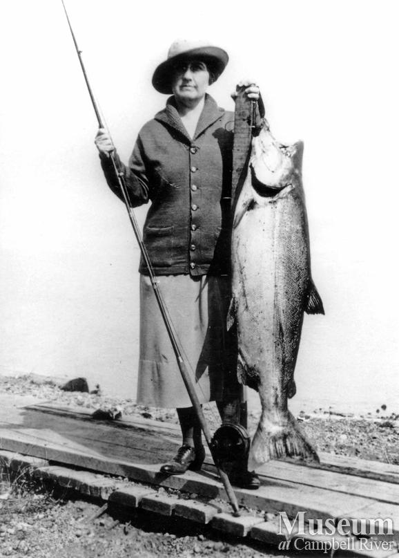 Unknown lady angler with fish